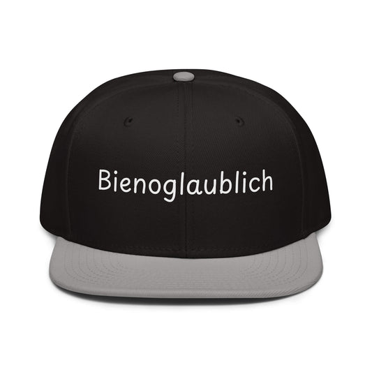 Bienoglaublich Snapback Cap in Schwarz - Grau aus Acryl-Woll-Mix - neues Wort für Leichtigkeit und Wachstum - Front - Wortstolz Design