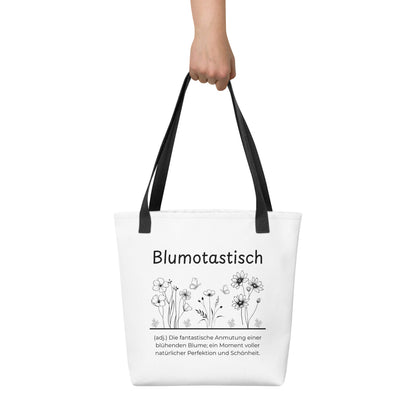 Blumotastisch - Stofftasche in Black -White aus Polyester und Baumwolle - Premium Edition - Frontansicht haltend in Hand mit schwarzem Print