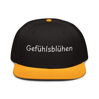 Gefühlsblühen Snapback Cap in Schwarz - Gold aus Acryl-Woll-Mix - neues Wort für Emotionen und Wohlbefinden - Front - Wortstolz Design