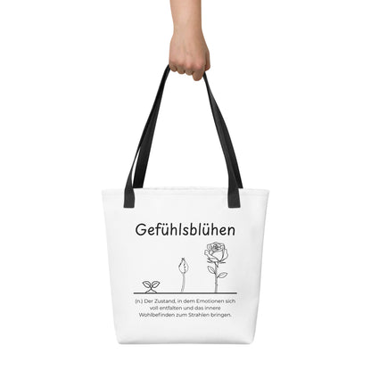Gefühlsblühen - Stofftasche in Black -White aus Polyester und Baumwolle - Premium Edition - Frontansicht haltend in Hand mit schwarzem Print