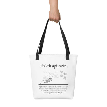 Glücksphorie - Stofftasche in Black -White aus Polyester und Baumwolle - Premium Edition - Frontansicht haltend in Hand mit schwarzem Print