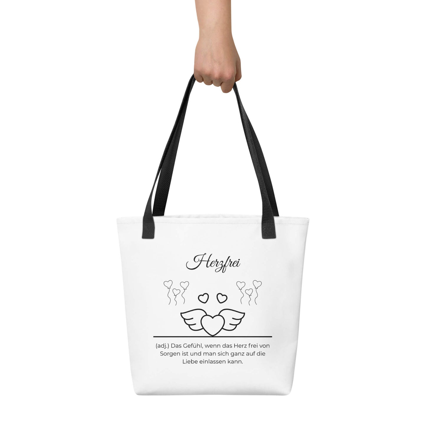 Herzfrei - Stofftasche in Black -White aus Polyester und Baumwolle - Premium Edition - Frontansicht haltend in Hand mit schwarzem Print