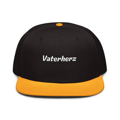 Geschenk Cap - Vaterherz Snapback Cap in Schwarz-Gold - Res5 Edition - mit weißem Print - Frontansicht