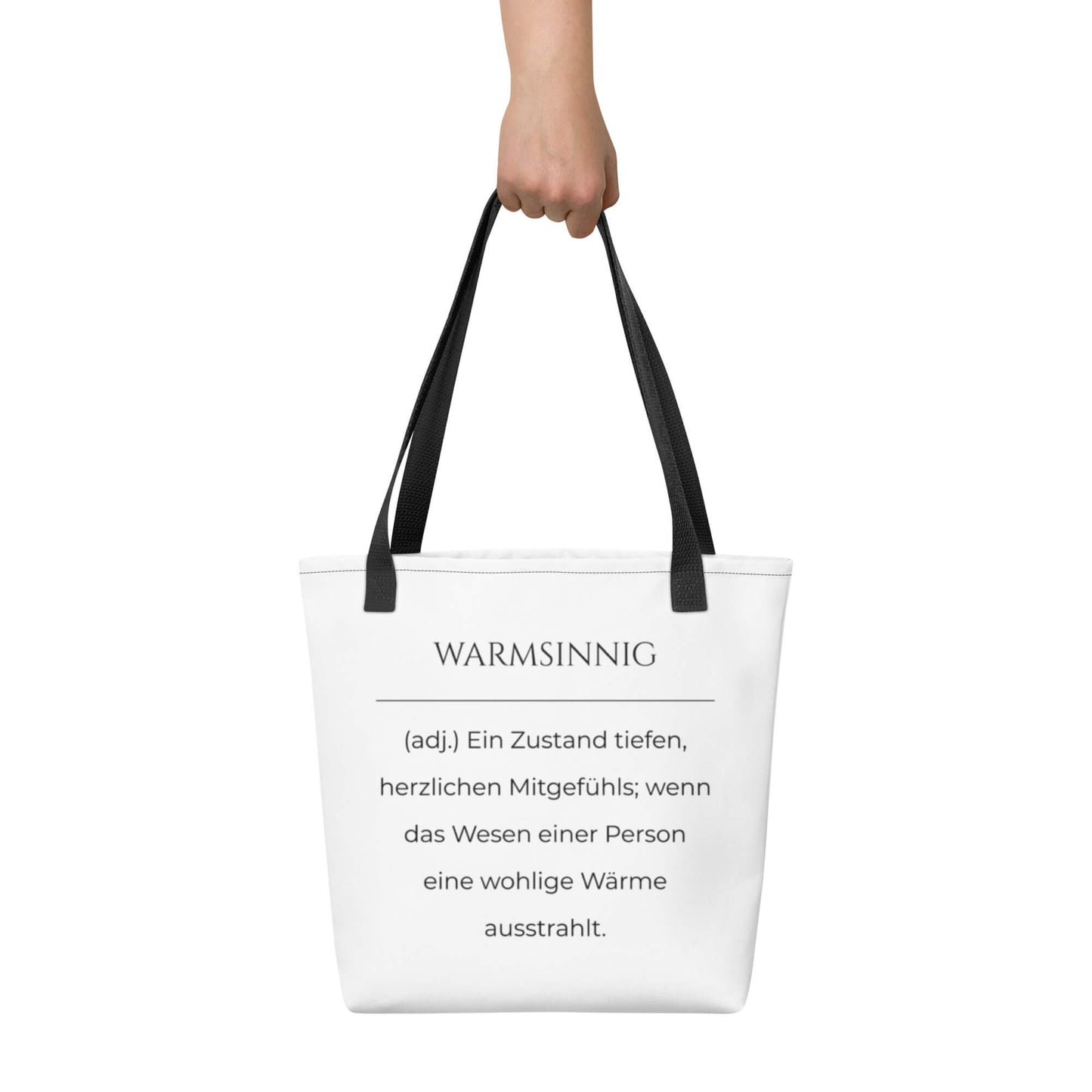 Warmsinnig - Stofftasche in Black -White aus Polyester und Baumwolle - Premium Edition - Frontansicht haltend in Hand mit schwarzem Print